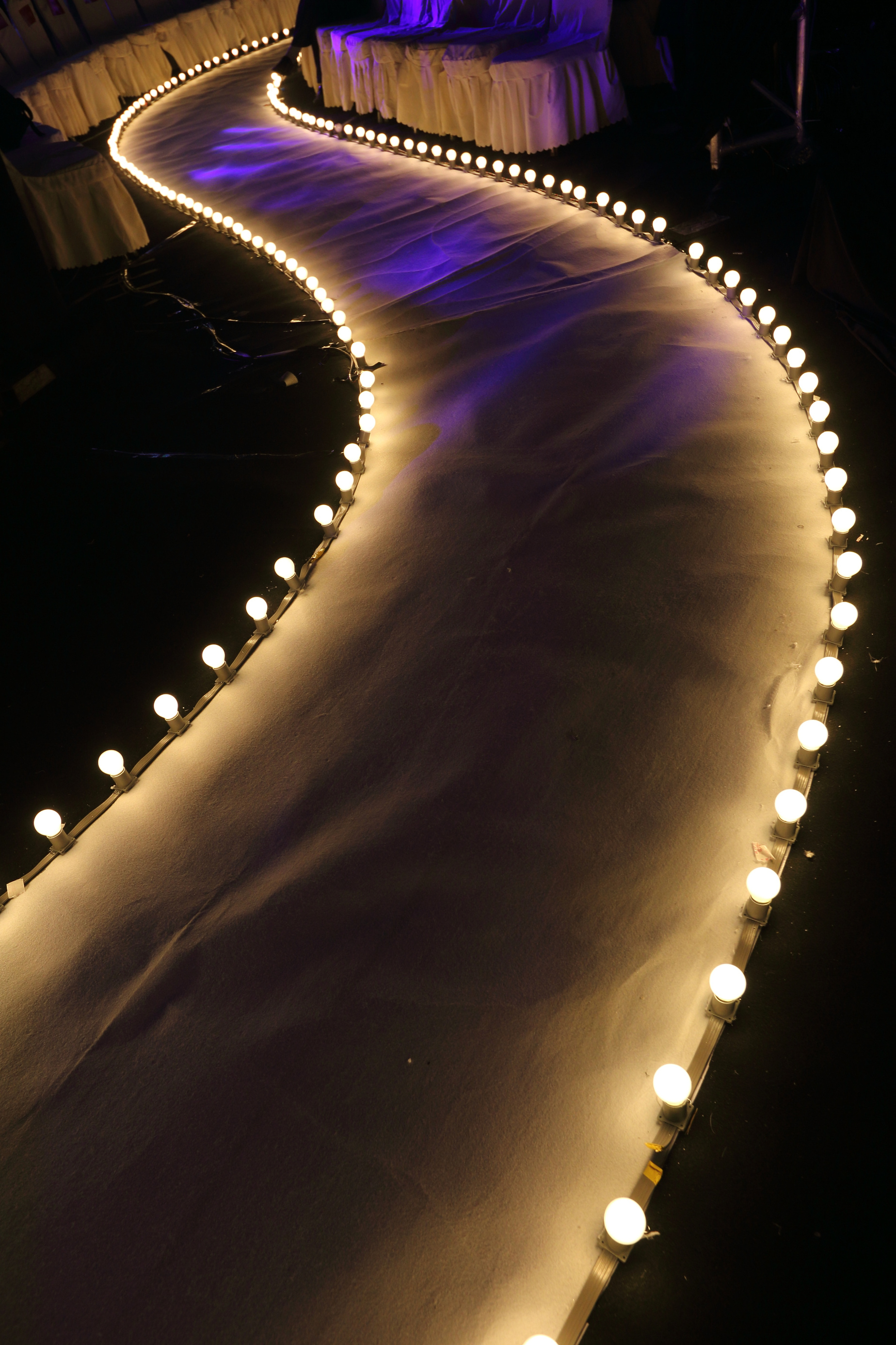 Runway Fashion Show with Ball glowing lighting along walk way